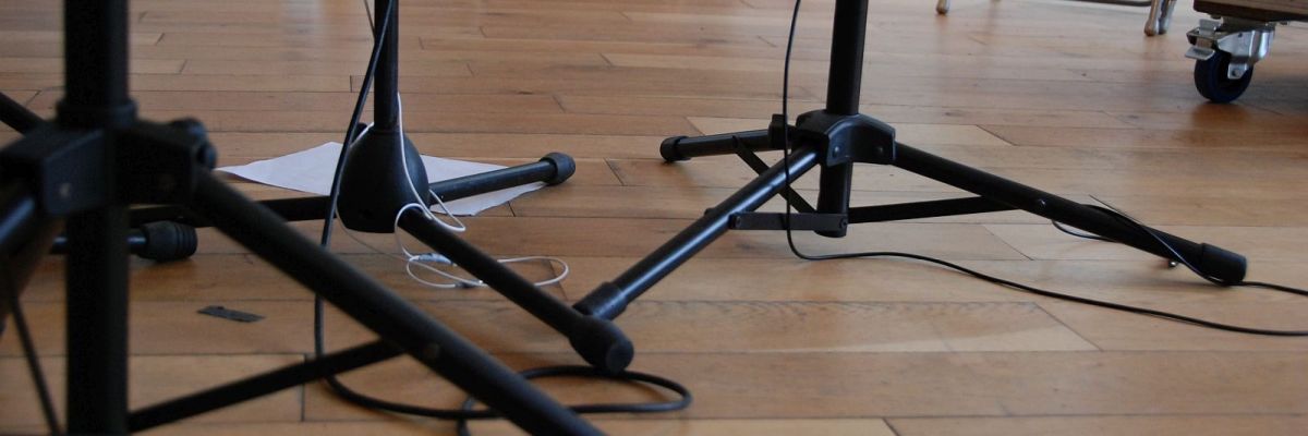An image featuring the legs of several music stands.